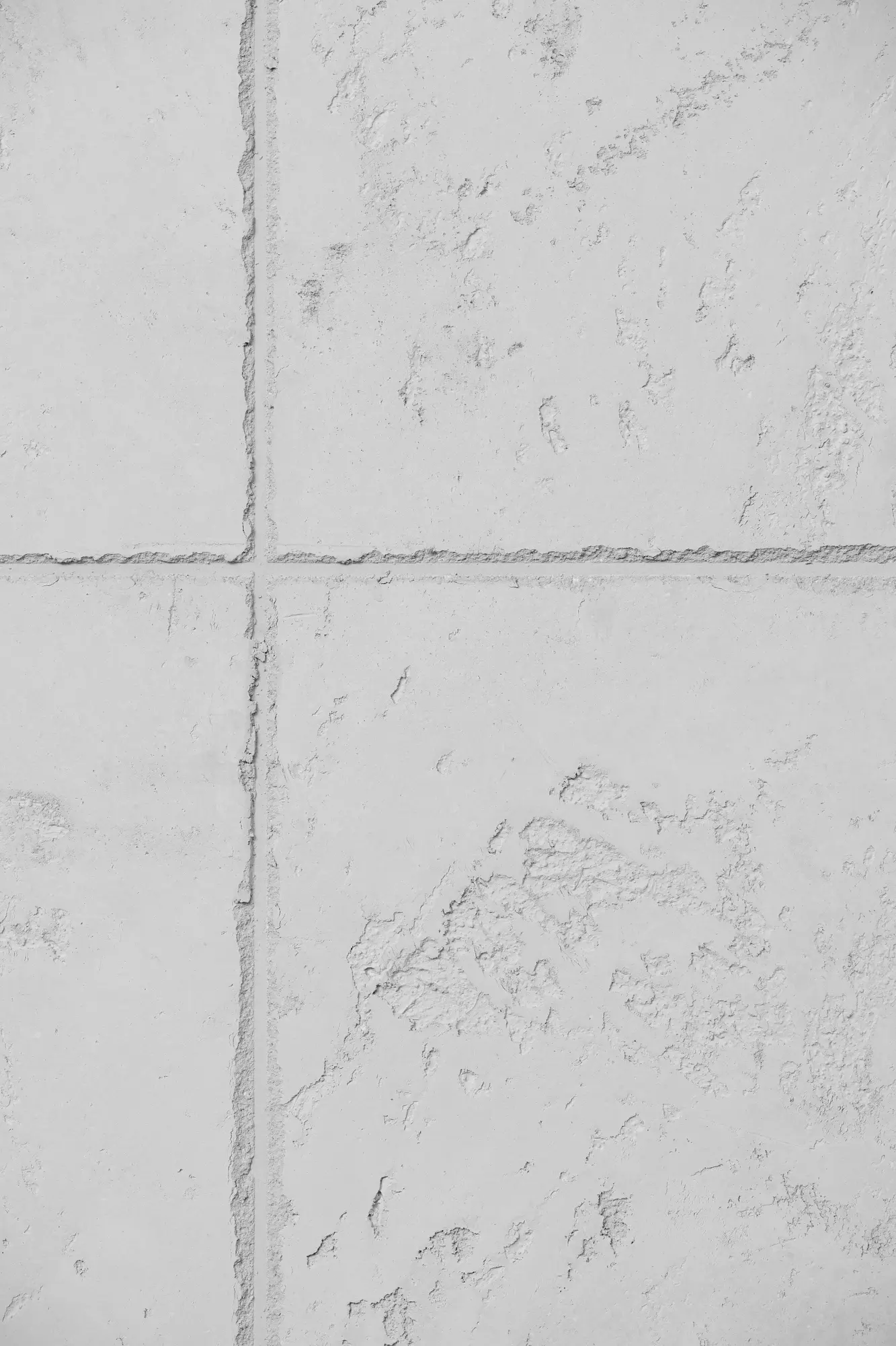 Helle, rau strukturierte Wand in Sichtbeton- oder Kalkputzoptik